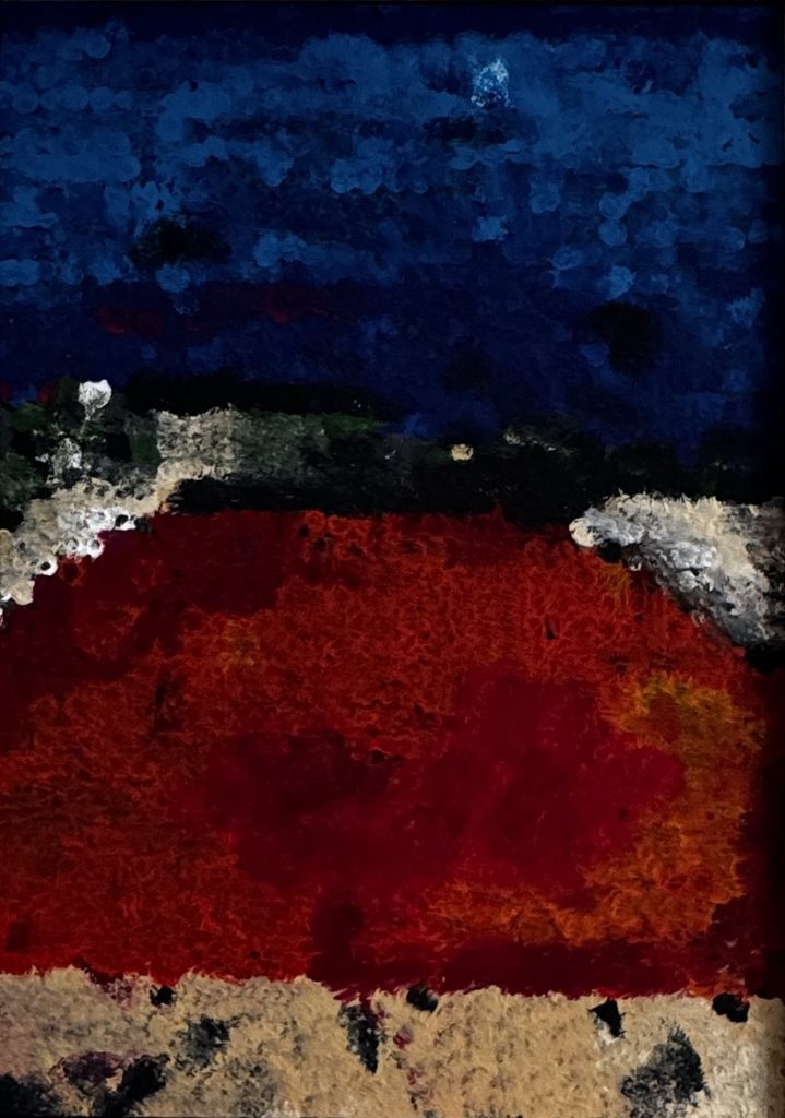 Bleu profond au-dessus d'un rouge en matière, bande de collage en bas